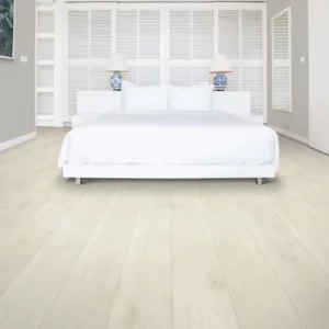 light-colored wood-look laminate in bedroom | Carpet Warehouse